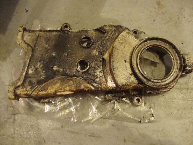 Worn timing chain cover. Junk